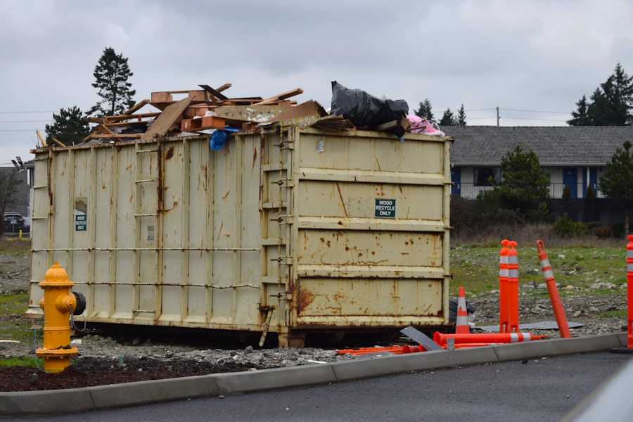 High-sided roll-off container staged at a roadside lot